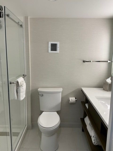 Finished bathroom with glass partition