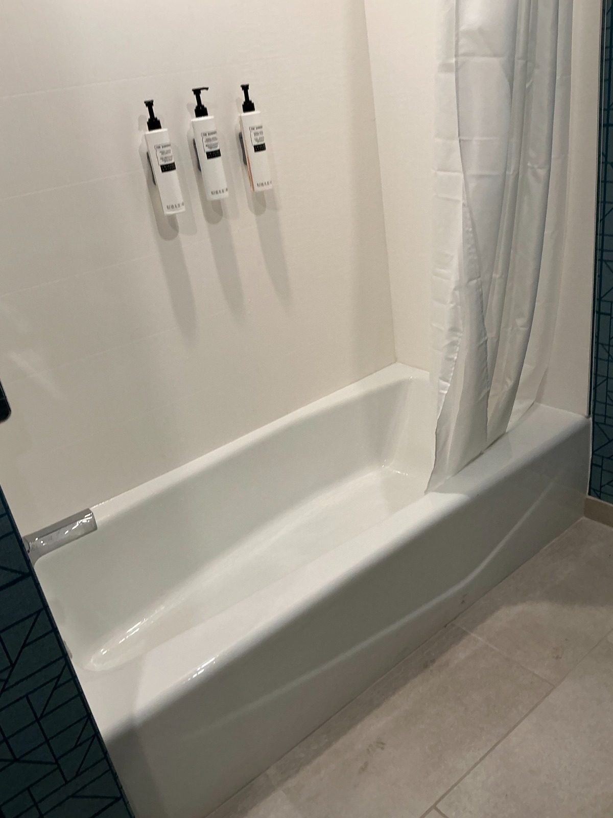 Shower enclosure with accent tile wall